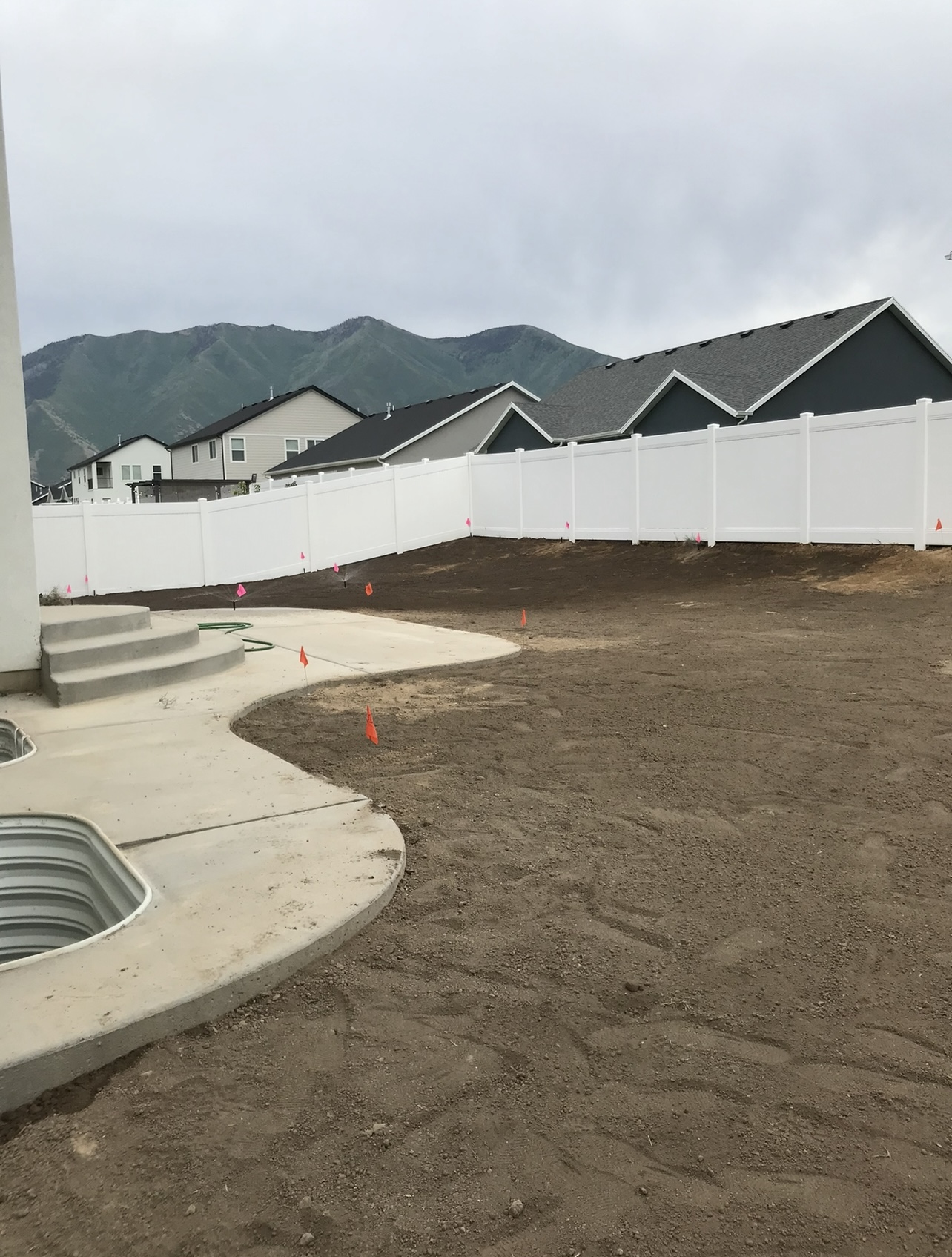 Backyard lawn area before sod installation and landscape preparation in Utah
