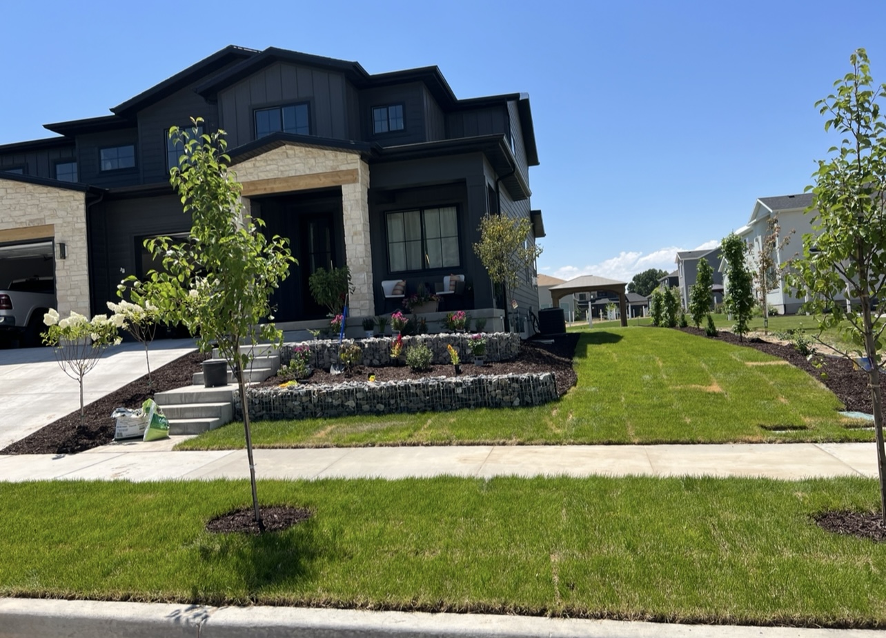 Front yard elevation landscape after gabion retaining wall and rock work in Utah