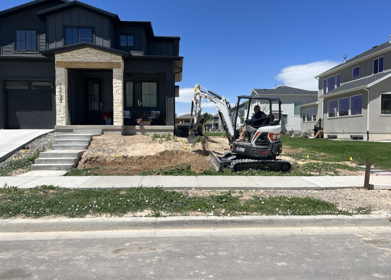 Front yard elevation landscape before excavation and retaining wall installation in Utah