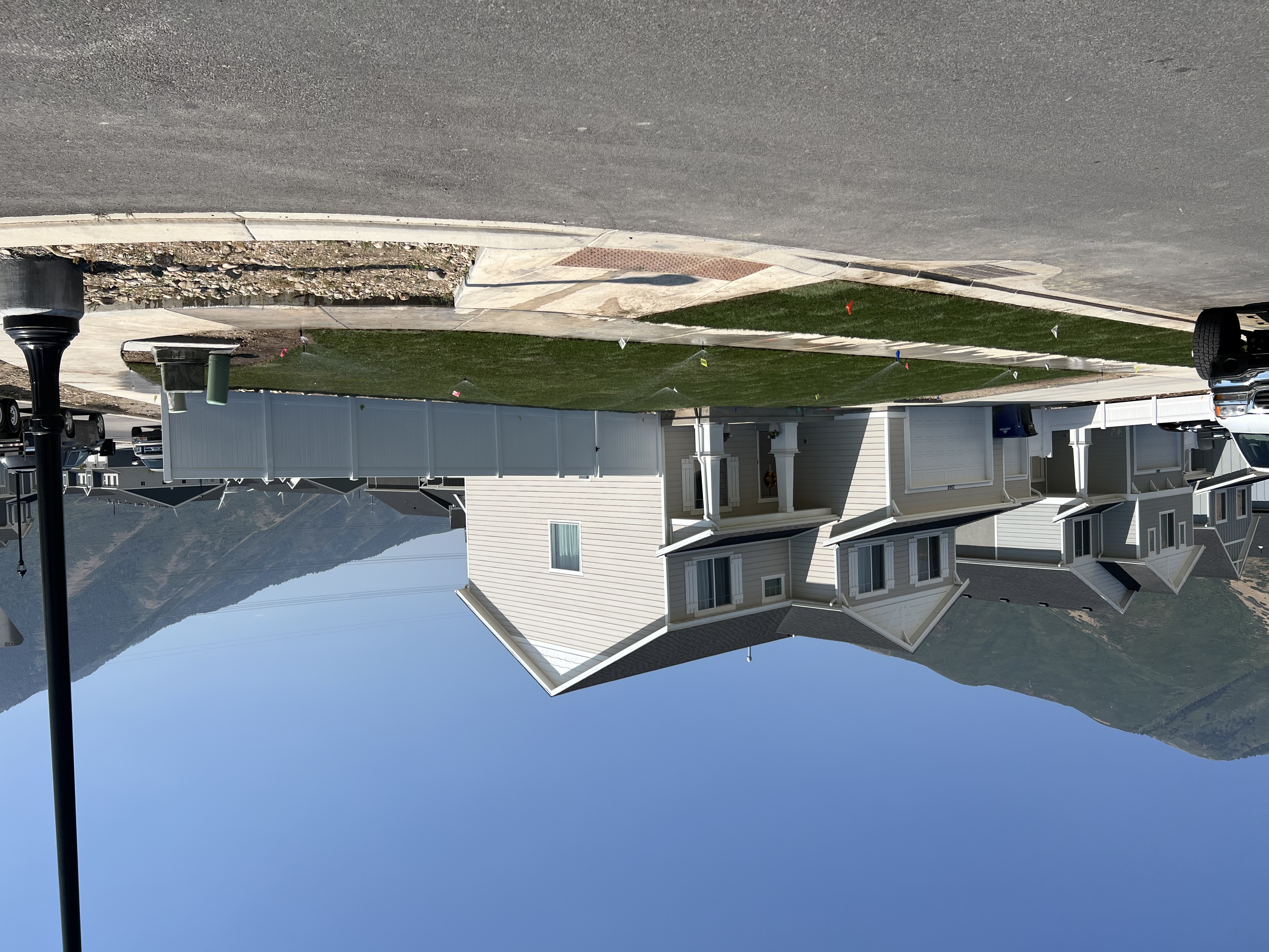 Completed new build corner lot landscaping with fresh front yard sod in Utah Valley