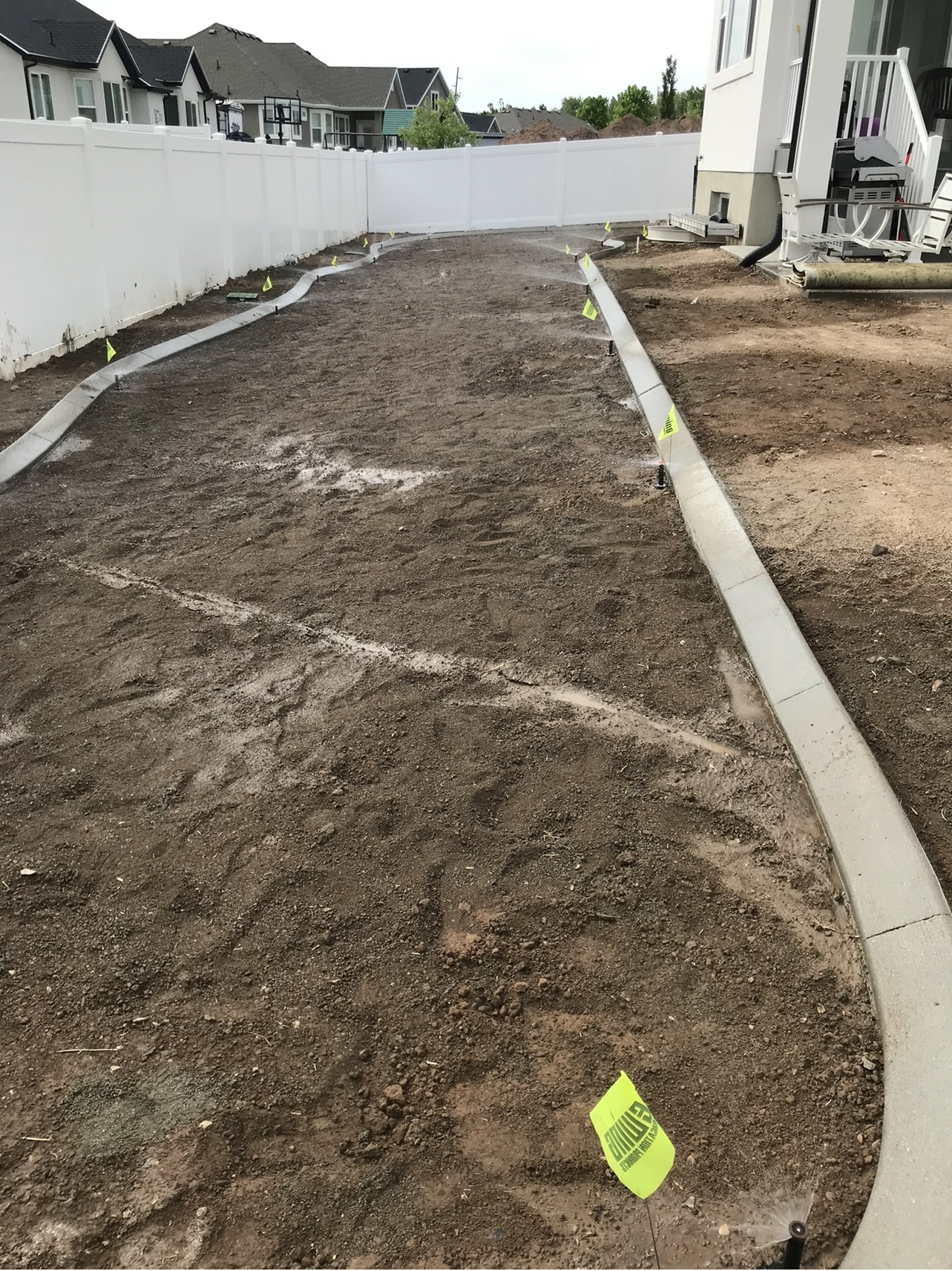 Backyard lawn before landscaping work